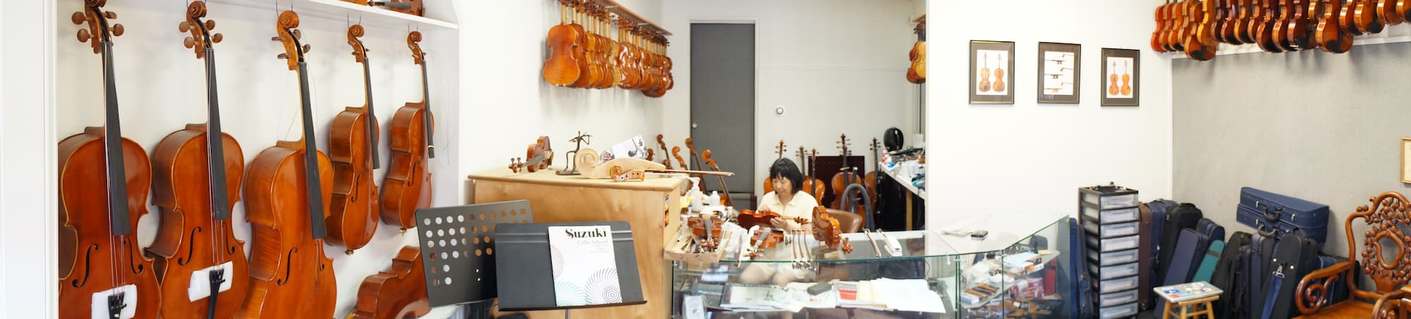 Mrs. Kot working in the violin shop